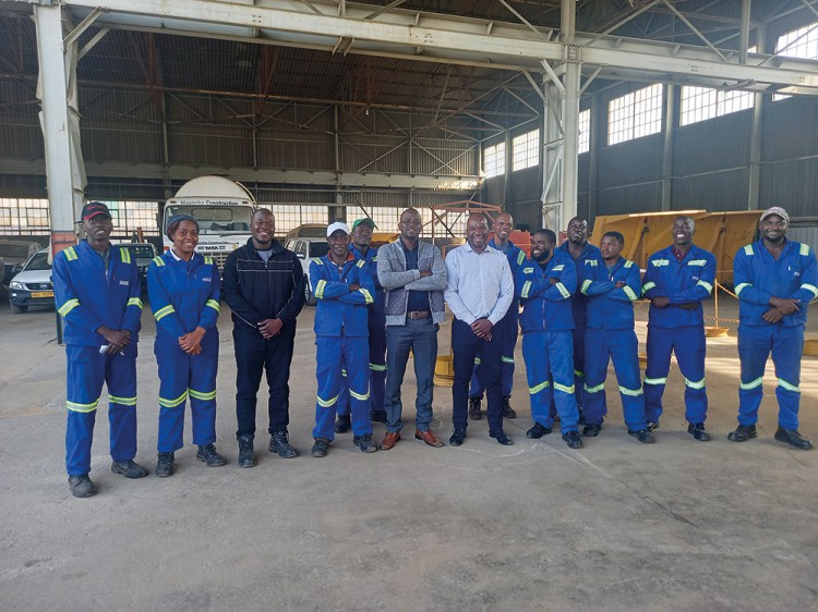 Shesby Chabaya (centre) of WearCheck Zimbabwe conducted oil analysis training for a team from Masimba, Zimbabwe.